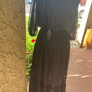 Elegant Black Dress with Sheer Sleeves